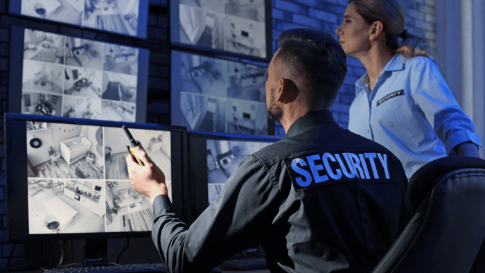 Security officer checking cameras