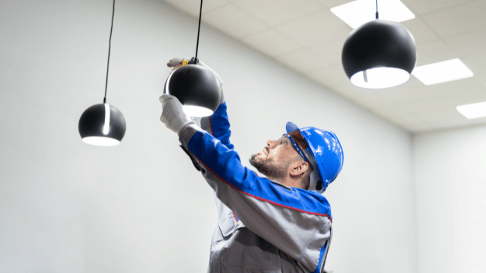Man fixing light