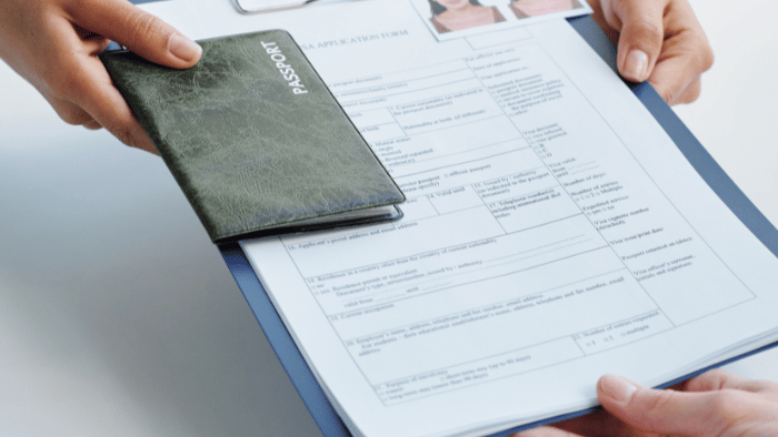 Agent handing over passport and form