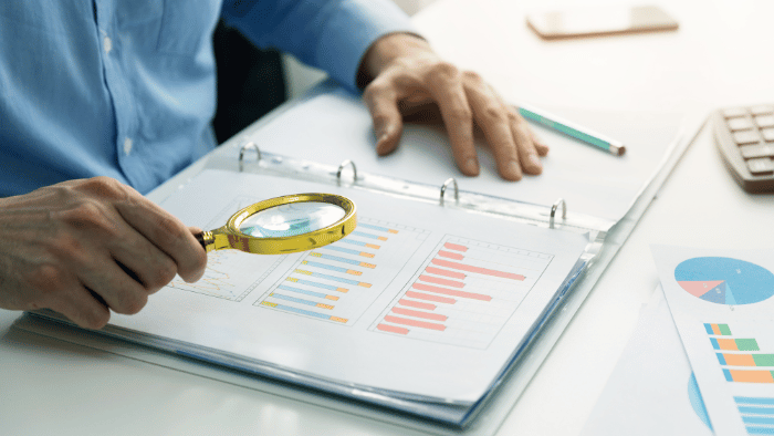 internal audit investigator looking at graphs