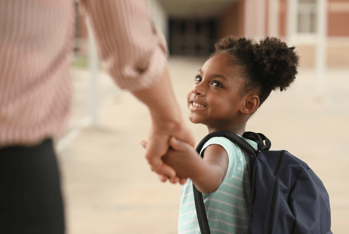 A child holding an adult's hand